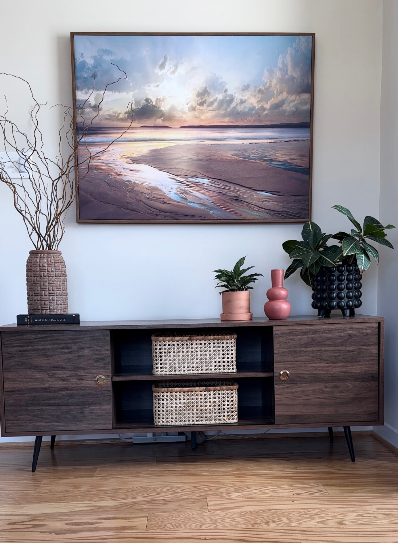 Mid-century modern console styled with natural woven storage bins.

#LTKsalealert #LTKhome
