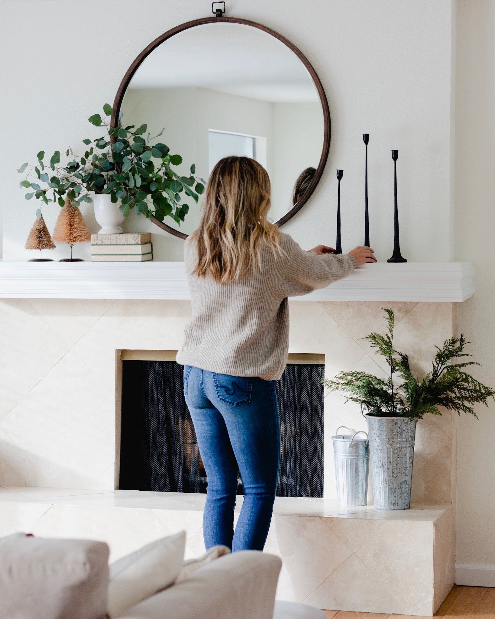 Simple holiday mantel decor ideas. Christmas decor. Winter decor round mirror. 

#LTKHoliday #LTKstyletip #LTKhome