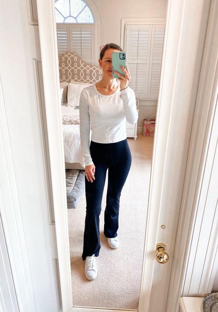 Obsessed with these high waisted flare leggings! Trust me, these are an amazing Lululemon dupe! So flattering and elongating. Under $40! Also love this white cropped long sleeve active top. Pairs nicely with high waisted pants/leggings. (*Wearing size small in everything) 

Activewear. Athleisure. Mom style. Groove leggings dupe. Align legging dupe. Lululemon dupe. Flare pants. Flare leggings. 

#LTKfitness #LTKGiftGuide #LTKfindsunder50