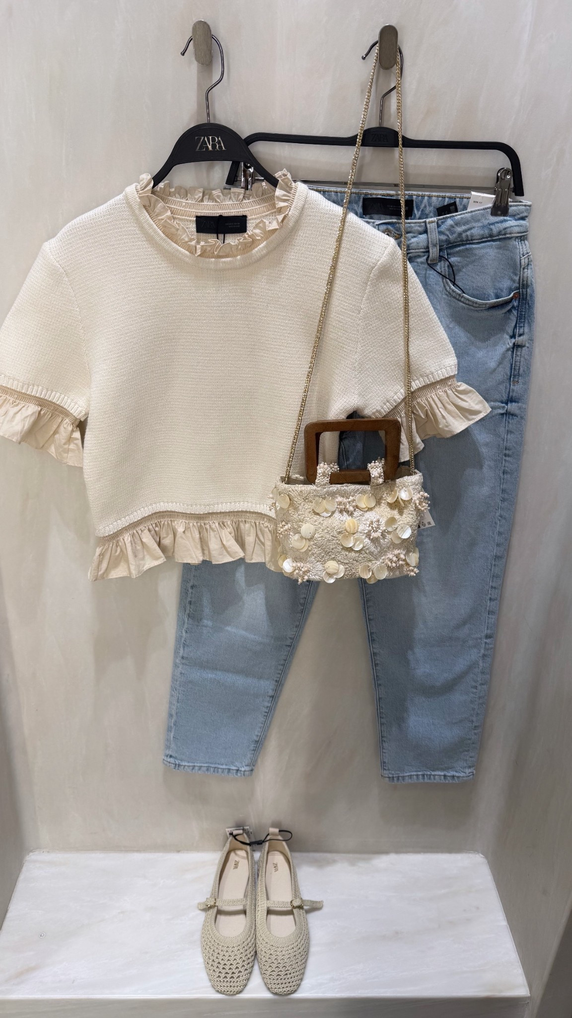 NEUTRAL OUTFIT🙋🏽‍♀️
Tags: new in Zara knit short sleeve jumper frill detail mom straight jeans high waist light wash appliqué mini bag wooden handle braided ballet flats trending style fashion spring city break inspo outfit ideas chic women’s ootd

#LTKspring #LTKsummer #LTKstyletip