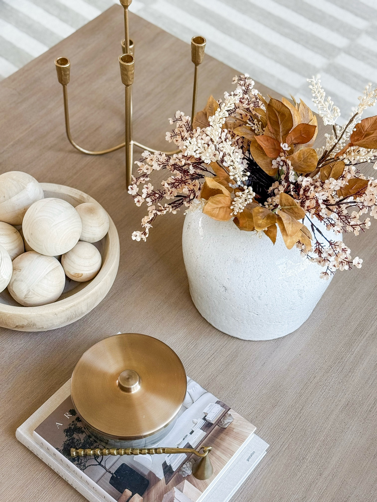 A simple fall coffee table styling, subtle enough as we transition to autumn!

Home, home decor, home finds, home accents, fall, fall home, fall home decor, fall florals, faux florals, candle snugger, candelabra, living room, coffee table, modern home, neutral home, organic home, area rug

#LTKHome #LTKSeasonal