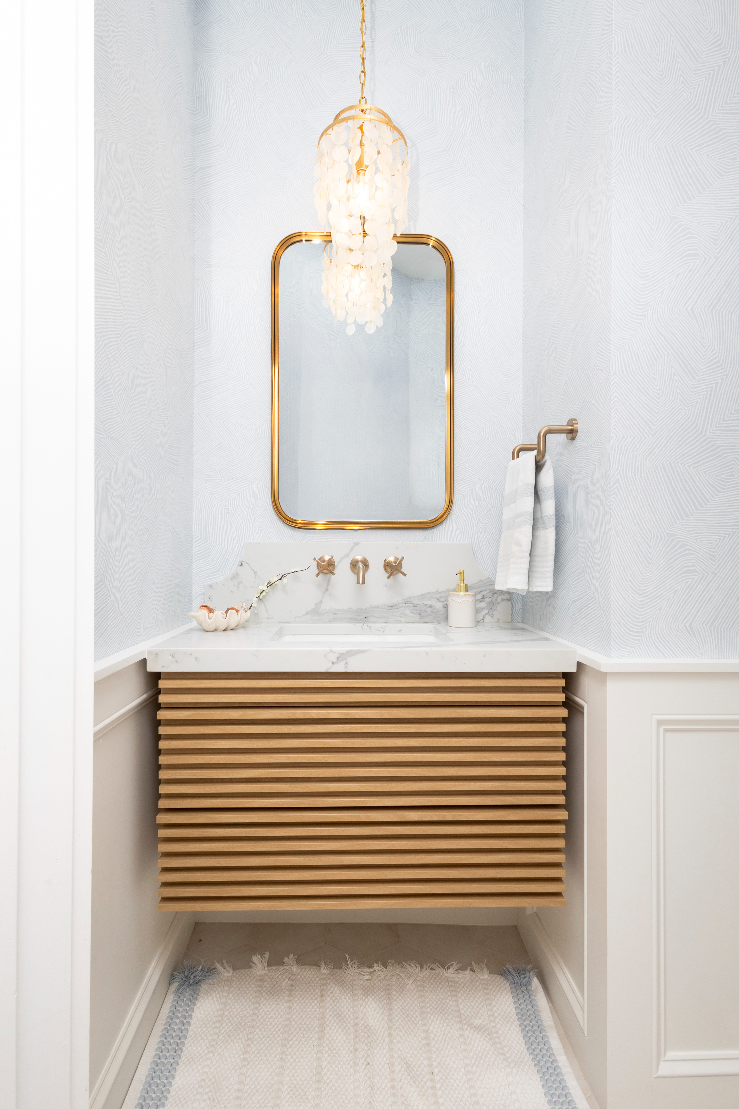 Seaside serenity, right at home 🌊✨ We transformed this petite powder room into a coastal escape. Tap to shop the details🤍 

 #LTKGiftGuide #LTKHome #LTKStyleTip