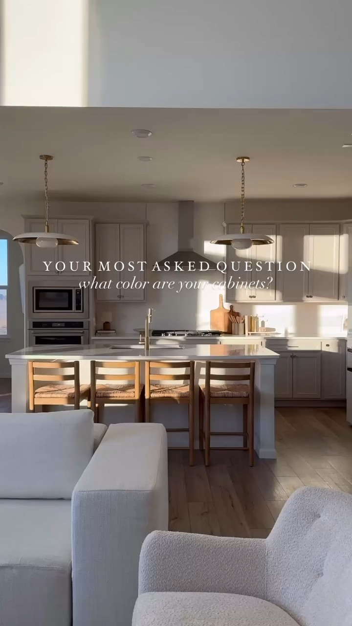 I get asked about our kitchen cabinets all the time, so here’s a closer look! Our cabinets are Glacier Gray on Purestyle laminate from Aristokraft, and the color match? Accessible Beige by Sherwin Williams-a perfect warm stone gray with earthy undertones.

To pull everything together, I added champagne bronze hardware, and it makes such a difference! It complements the tones beautifully and adds a nice touch of warmth. 
I hope this helps🫶🏼

