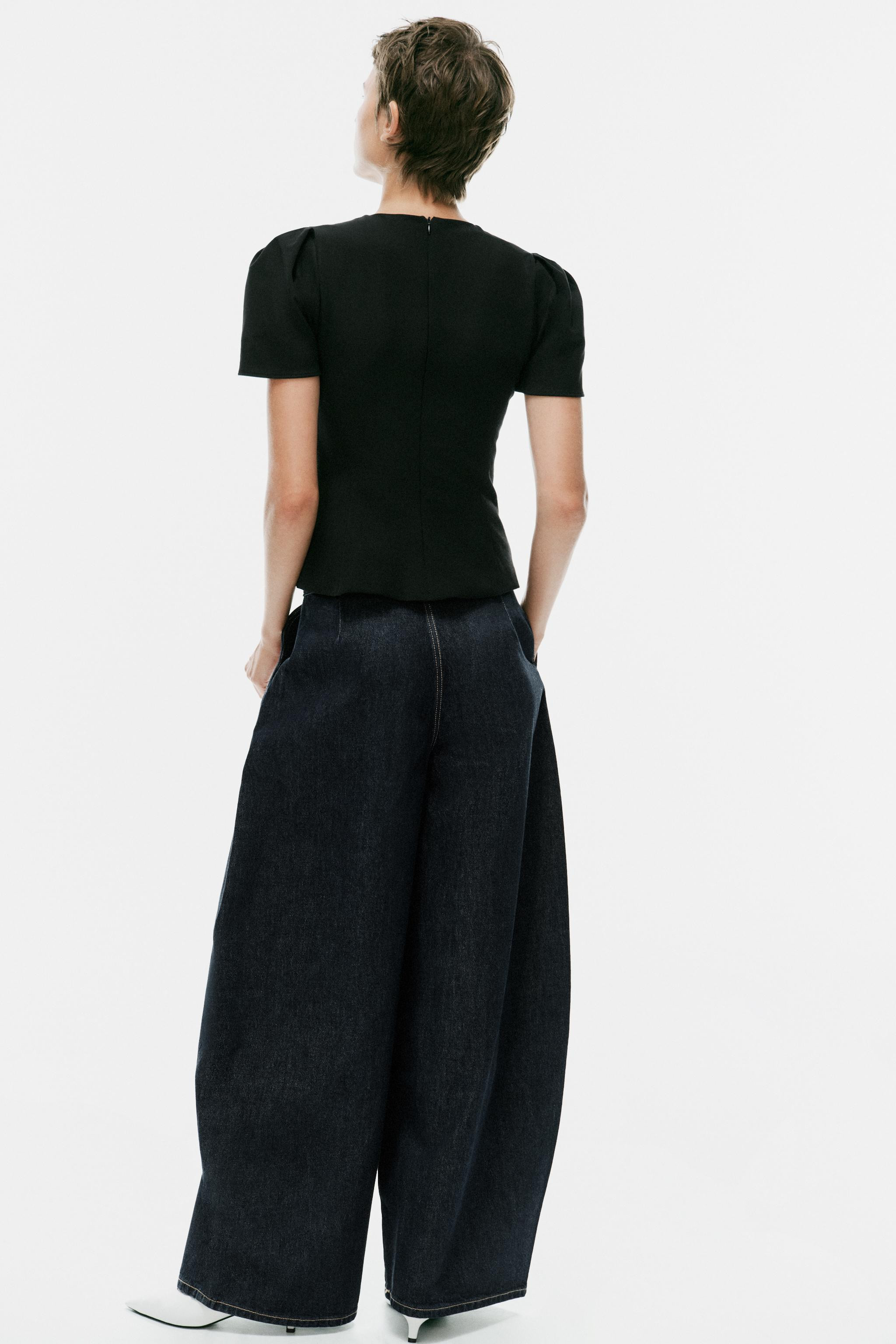 Model height: 179 cmRound neck top with short puff sleeves. Fastens at the back with a concealed ... | Zara UK