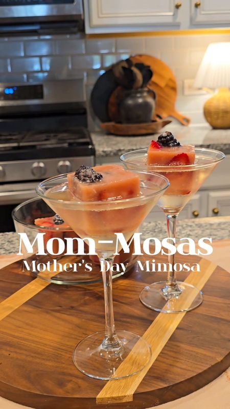 MOM- Mosas!🍸🍷Perfect way to make Mother's Day brunch special! Here's my take on this viral ice trend.  I absolutely loved it! Turned out so beautifully! BUT,  it's really just for show.😩 You still need to add juice  to your glass to get the Mimosa effect. By my second pour, the ice was still a block. It took a while to melt.  So just know that if you plan on giving this a try.   I still think it's totally worth it for how fancy it looks sitting in your glass!Alao, I would use a coupe, martini, or a margarita glass over a wine glass or a flute. Directions: I placed the strawberry slices around the edge of each square and added 2 blackberries to the center.  Added strawberry  bannana smoothie from Naked. You could also use orange juice. Freeze overnight. Add one block of ice to your glass of choice and fill with prosecco and (more juice)!🍷🍸🤍

#LTKVideo #LTKGiftGuide #LTKhome