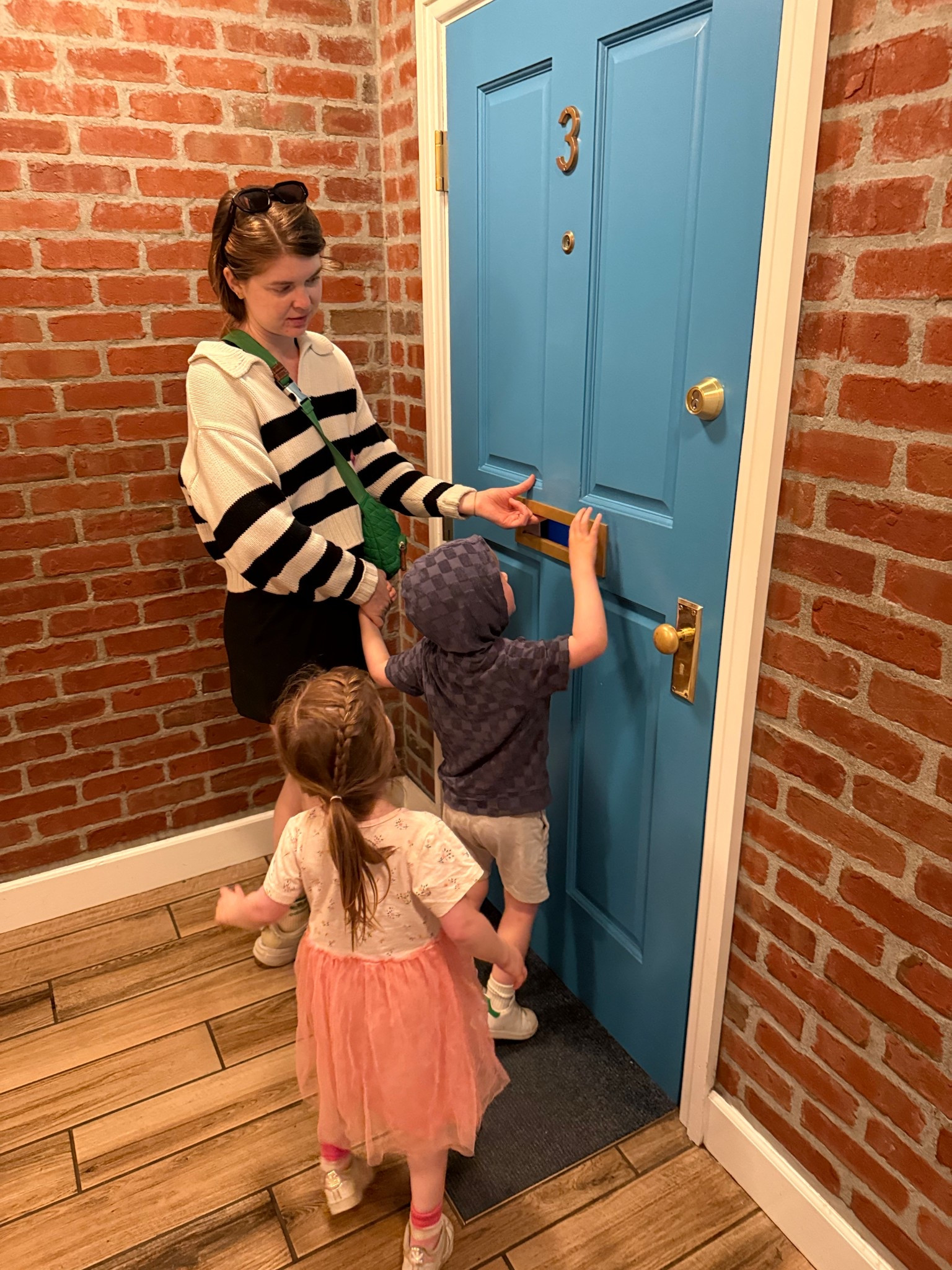 Women’s organic cotton striped polo crop sweater - wearing a S , green sling bag 