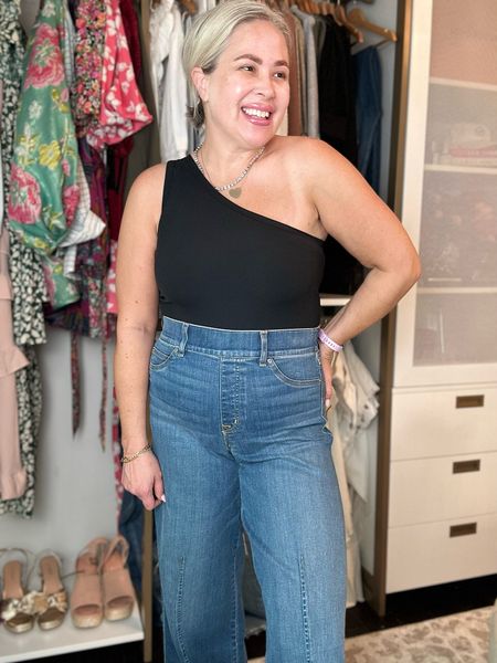 I love these jeans so much. They are a wide leg pant and very flattering 
Bodysuit is tucked in. Not snapped. 

All size large 
Code WANDAXSPANX saves 19% 

#LTKGiftGuide #LTKworkwear #LTKFind