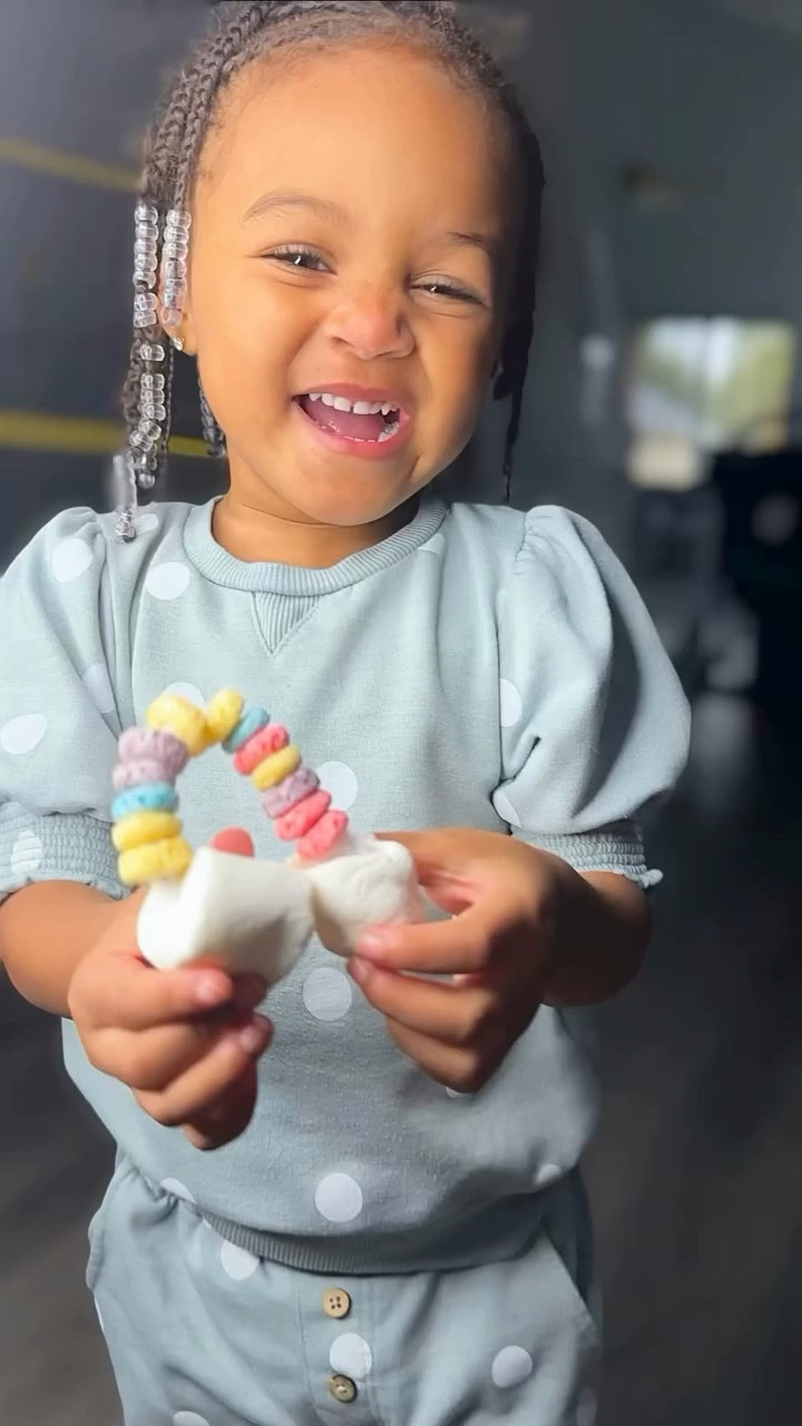 Trying to do crafts and sensory bins with food with professional toddler snackers is quite the experience! From eating the pieces, stacking the marshmallows, using the marshmallow as a make up sponge, and picking out specific colors, they were quite creative and had so much fun! She was quite pleased with her mini rainbow!
.
Put it all together and let the fun begin!
⭕️ Fruit loops
◽️ Marshmallows 
❕ Pipe cleaners
.
This little box packs so much playful learning.
1️⃣ Fine motor skills: Picking up individual pieces of fruit loops, marshmallows, and manipulating pipe cleaners encourages the development of hand-eye coordination and fine motor skills.
2️⃣ Creativity: Exploring different ways to use the materials in the sensory bin can spark creativity and imagination in toddlers.
3️⃣ Color recognition: Sorting and categorizing the colorful fruit loops and marshmallows can help toddlers learn and recognize different colors.
4️⃣ Counting and sorting: Counting and sorting the different items in the sensory bin can introduce basic math concepts to toddlers, such as counting, grouping, and comparing quantities.
5️⃣ Sensory exploration: Engaging with different textures (crunchy fruit loops, soft marshmallows, and bendable pipe cleaners) stimulates sensory exploration and helps toddlers learn about their environment through touch and feel.
6️⃣ Problem-solving: Encouraging toddlers to manipulate the materials in the sensory bin fosters problem-solving skills as they figure out how to thread the pipe cleaners through the loops or stack marshmallows on top of each other.
.
Toddler crafts, toddler activities, sensory play

#LTKbaby #LTKfamily #LTKkids