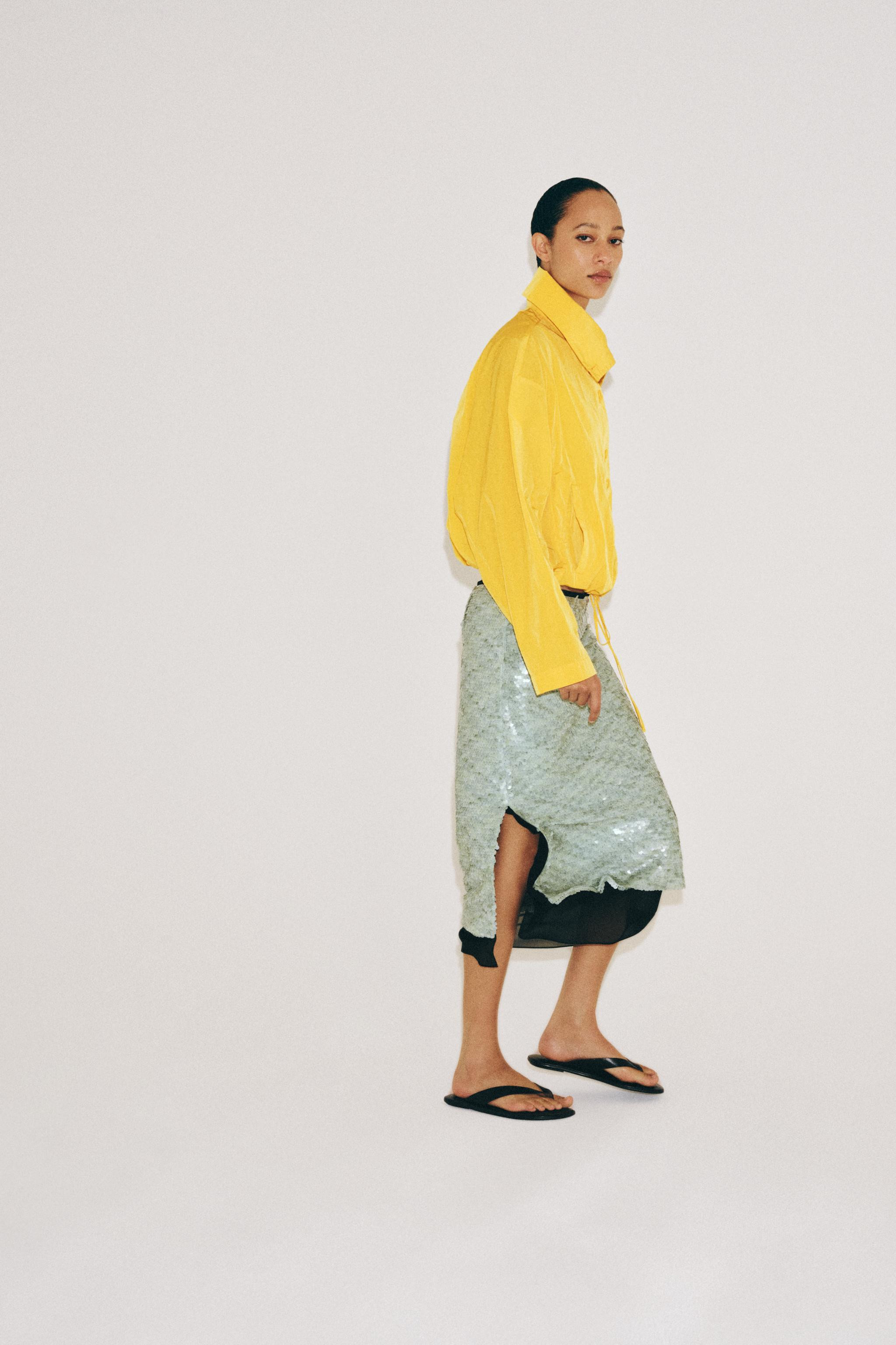ZARA WOMAN COLLECTION. Midi skirt with an elastic waistband and adjustable ties. Contrasting lini... | Zara US