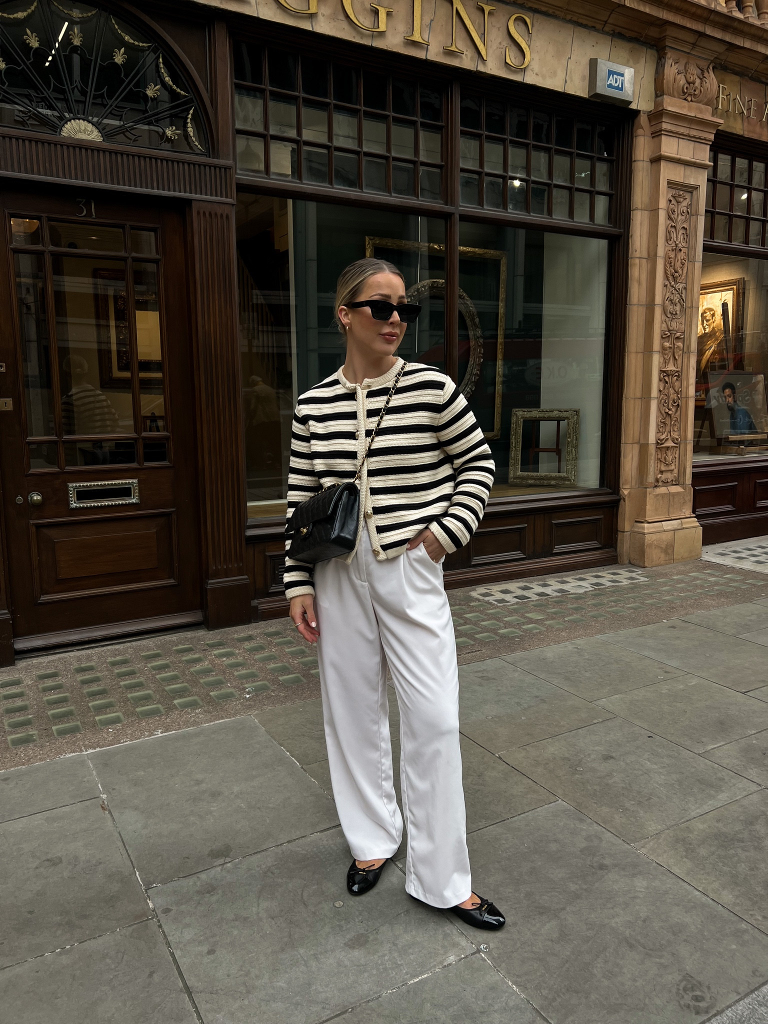 Transitional style, spring style, new in season, outfit inspiration, Massimo Dutti striped cardigan, cream trousers, Prada Ballet Flats, Celine belt, Anine Bing sunglasses, Chanel bag 

#LTKeurope #LTKSeasonal #LTKstyletip