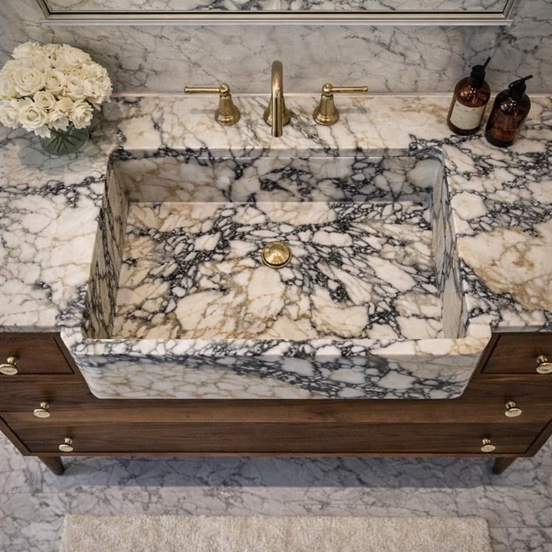 This is the statement your bathroom has been missing 😍🤍✨
Solid marble, carved backsplash, and that dreamy fluted detail… it instantly feels high end and designer

One piece completely transforms the space into a luxe, elevated moment 👀💫
Trust me you need this

#LTKMothersDay #LTKgrwm #LTKdayinmylife