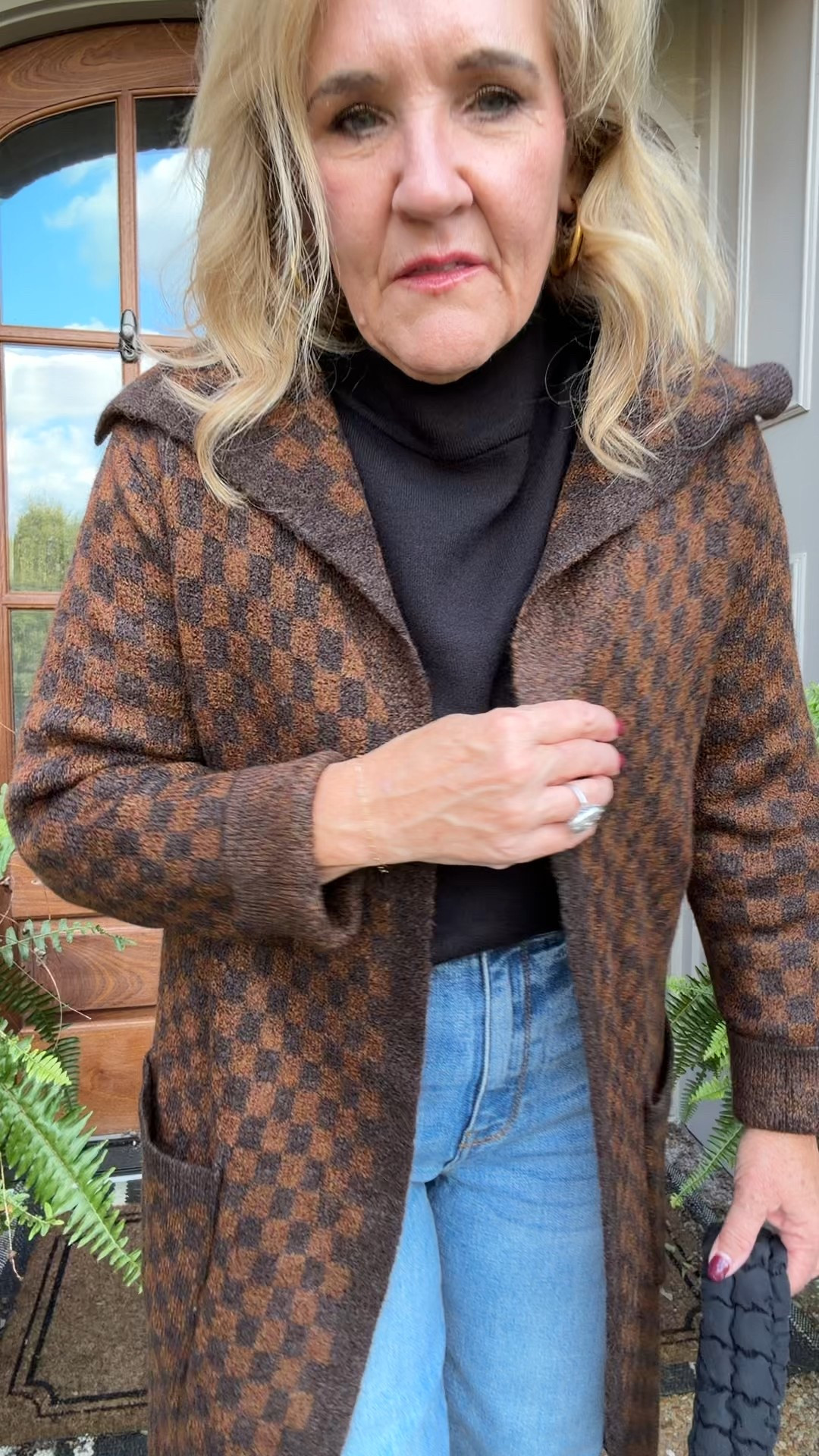 Love this sweater duster cardigan. Wearing a medium in all the rack scores! 

Avara black Jackie sweater. The sleeves are a bell sleeve and it’s a swing sweater style. Probably not the best sweater to wear under this cardigan but it’s a great black sweater. I’ll link the J.Crew Merino wool turtleneck that I have on order
Jeans are kut from the Kloth you have to size down in these I am in a six
Leopard sneakers match everything!

Fall layers, false sweater, Nordstrom rack, checkered sweater, mocha, brown, cuffed jeans

#LTKSaleAlert #LTKFindsUnder100 #LTKOver40