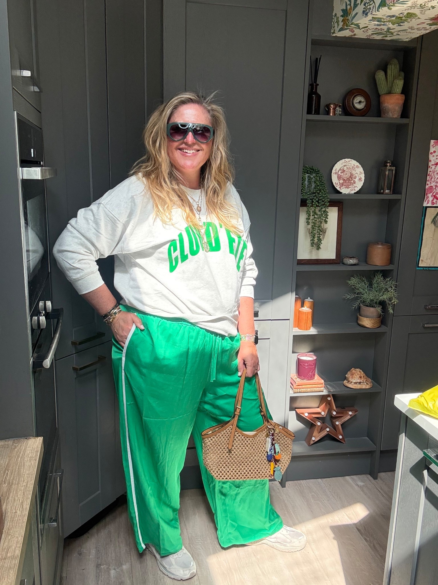 Great sweatshirt, green wide leg trousers, green sunglasses, straw bag, trainers 

#LTKstyletip #LTKspring #LTKplussize