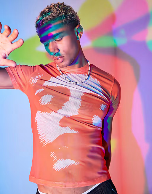 ASOS Unrvlld Spply skinny fit shrunken power mesh t-shirt with graphic front print in orange | ASOS (Global)