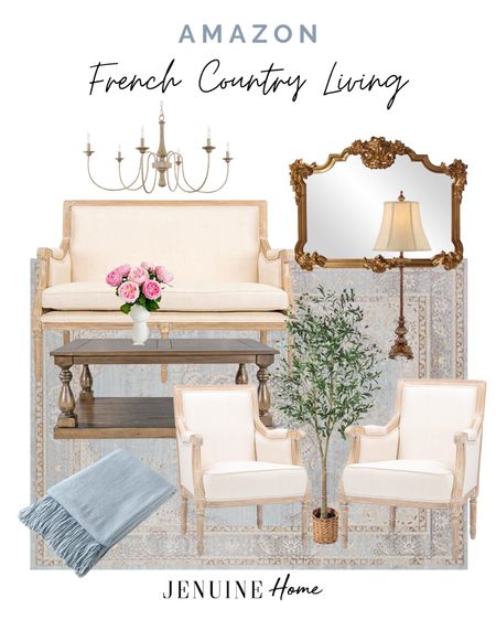 French country living room. French country sofa. French country arm chair. Blue French country rug. Light blue throw blanket. Faux olive tree. Ornate gold mirror. French country lamp. French country chandelier. Faux pink roses. Wooden coffee table  