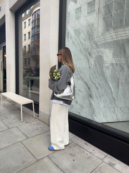 Grey jumper, white t-shirt, white wide leg jeans, blue suede trainers, silver shoulder bag, sunglasses

#LTKstyletip #LTKSeasonal #LTKeurope