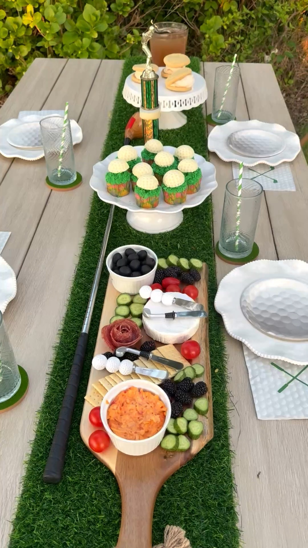 Masters golf tablescape idea. Homemade golf ball cupcake toppers, a delectable cheeseboard with pimento cheese, golf inspired cheese knives, a faux grass table runner, my grandpa’s golf club and brother’s golf trophy for sentimental reasons ⛳️ ❤️💚

#LTKHome #LTKfoodie #LTKSeasonal