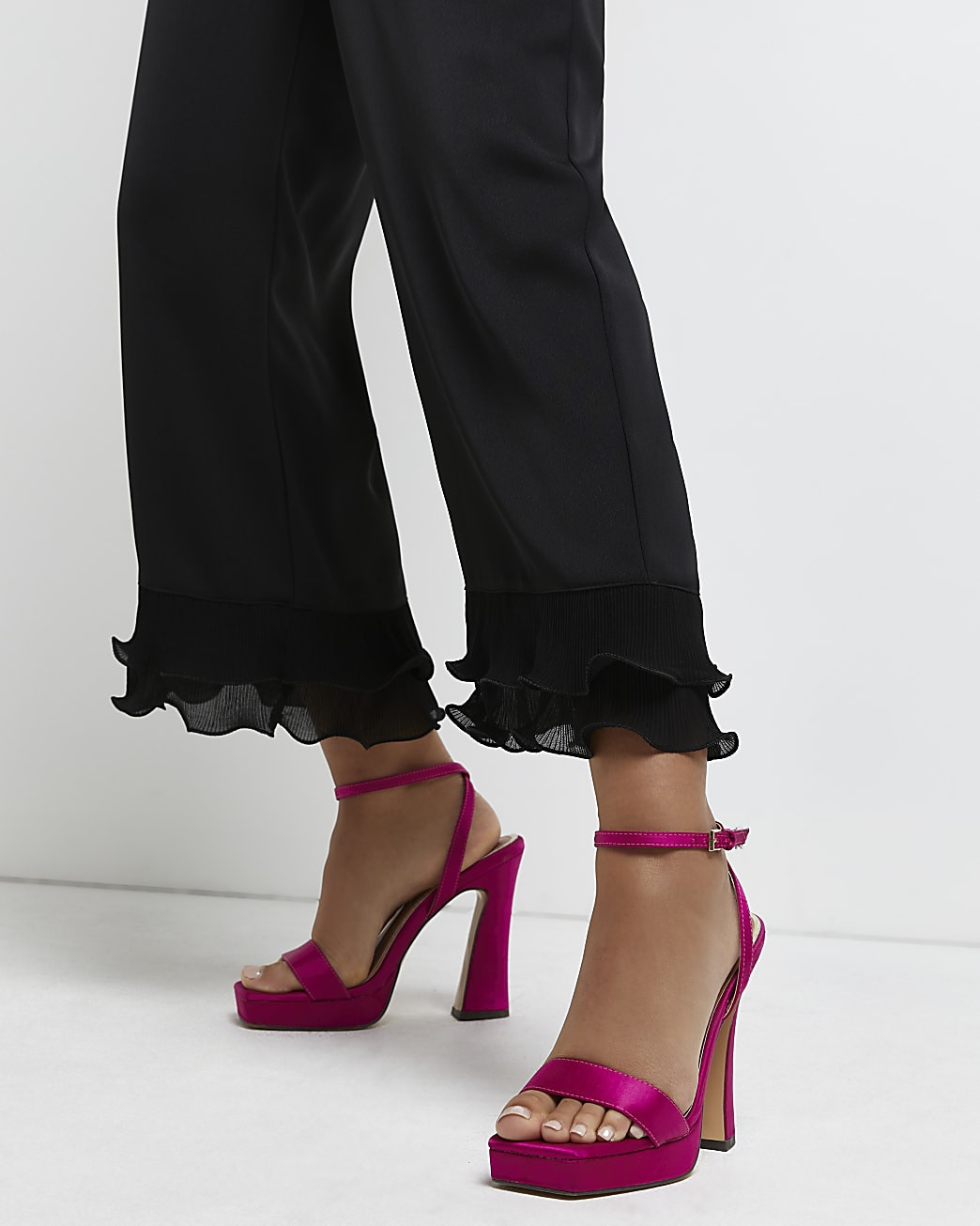 Black ruffle hem trouser | River Island (UK & IE)