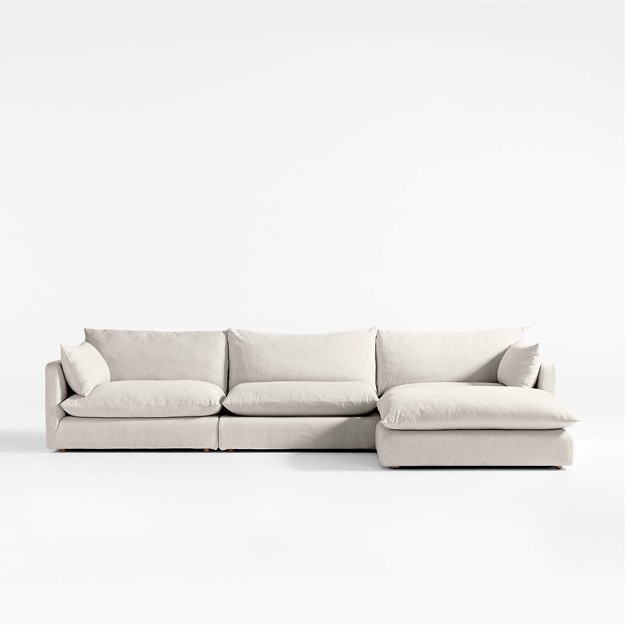 Unwind Modular 4-Piece Slipcovered Reversible Sectional Sofa with Ottoman + Reviews | Crate & Bar... | Crate & Barrel