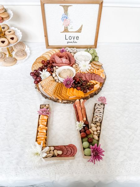 It’s so easy to make your own “cute” charcuterie board

Just get:
•A Ready-to-go charcuterie cheese/ meat tray 
•Fresh Fruit 
•Nuts 
•Pretzels 
•Crackers 
•Dips
•Artificial or real flowers 
(if you’re using real flowers, make sure to cover the stem with clear saran wrap) 
•Platter/ cardboard letters 
• Parchment paper

Arrange in a cohesive manner and that’s it! You just made a beautiful charcuterie board!✨

#LTKfamily #LTKGiftGuide #LTKkids