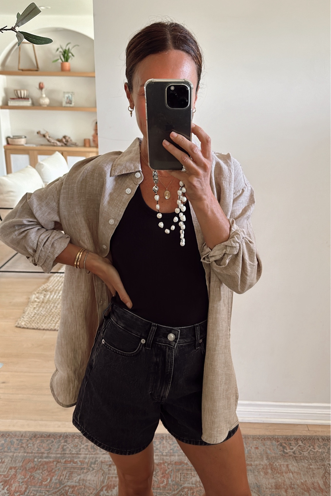 Today’s casual outfit 
Love these high waisted black denim shorts- length and rise is perfect run tts 
Black basic tank is a great wardrobe staple tts 
And this oversized oatmeal linen shirt is 10/10 so good- wearing an xxs 

#LTKOver40