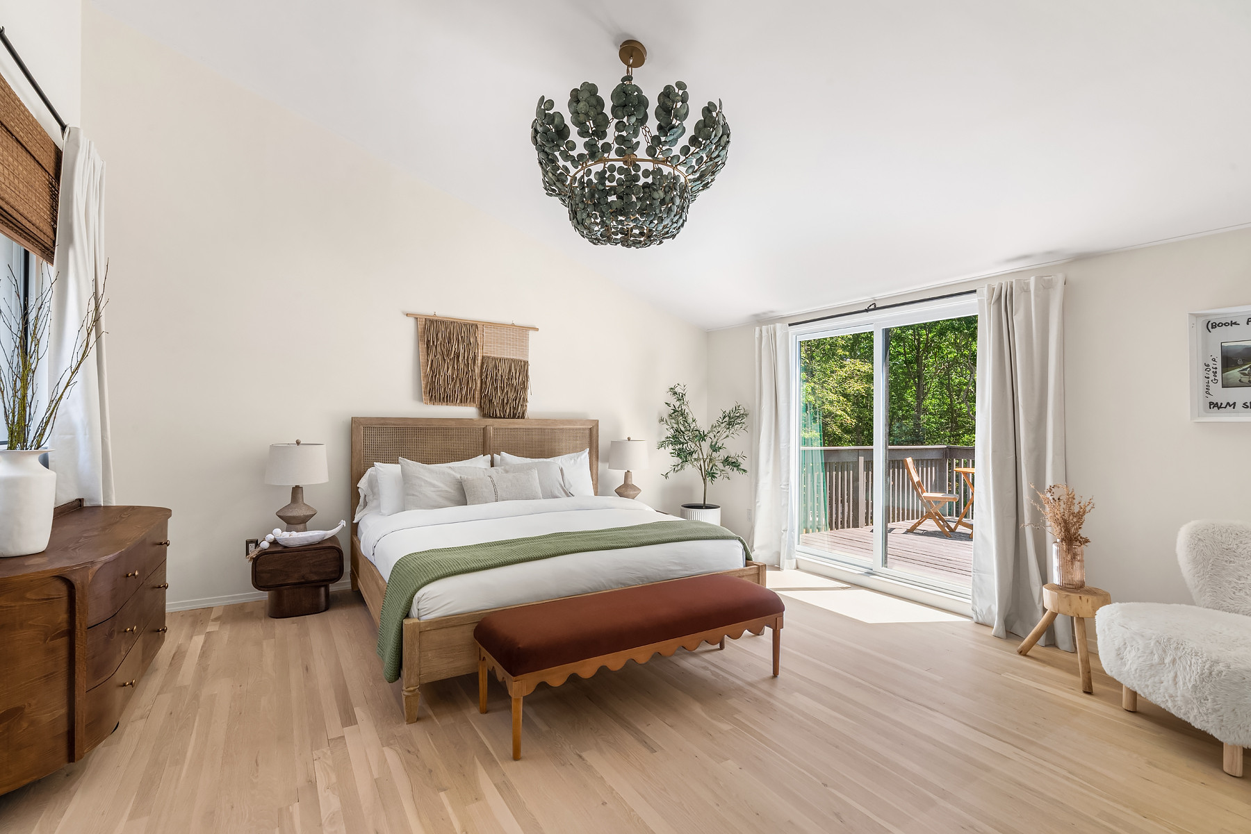 The primary bedroom is all about creating that boutique hotel feeling. We layered crisp white bedding with warm wood tones, soft textures, and a simple green throw for just enough color. Everything is designed to feel calm, comfortable, and easy to maintain for guests.

Linking the exact and similar pieces here.

#LTKHome #LTKSaleAlert