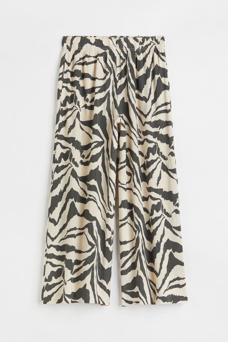 Ankle-length pants in softly draped, woven viscose fabric. High waist, covered elastic at waistba... | H&M (US + CA)