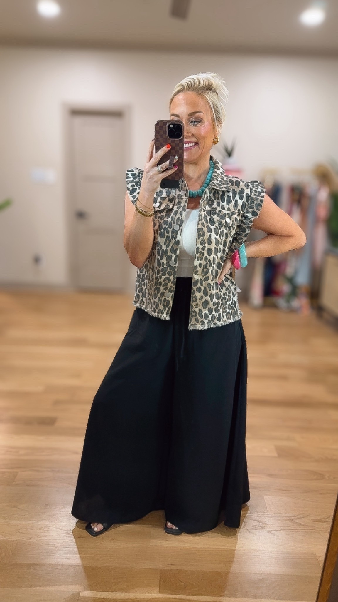 The cutest ruffle leopard vest and these black wide leg pants 