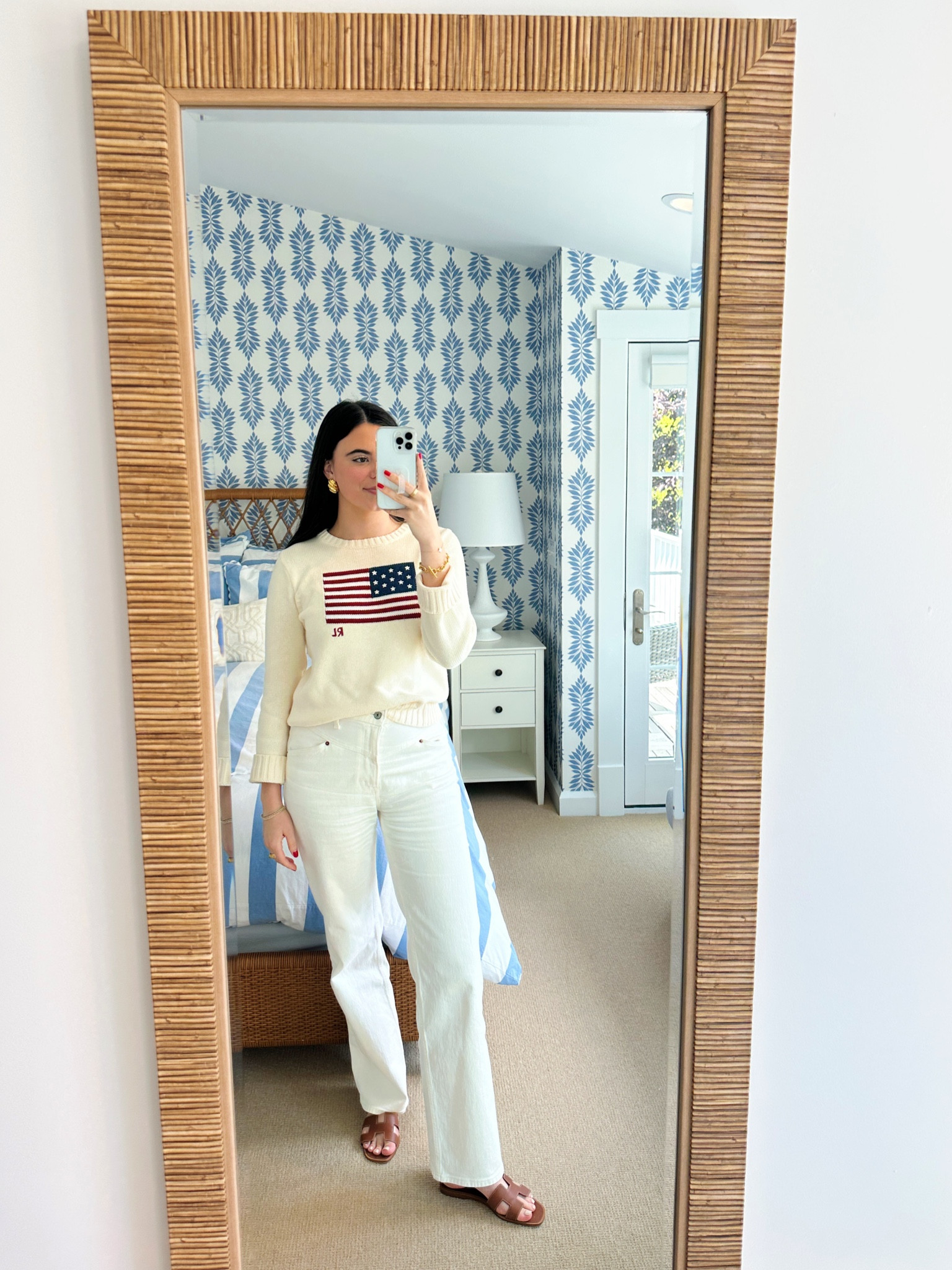 Simple summer look! Wearing my Ralph Lauren flag sweater in white 🇺🇸 jeans are abercrombie! Linking a dupe to my Hermes sandals 