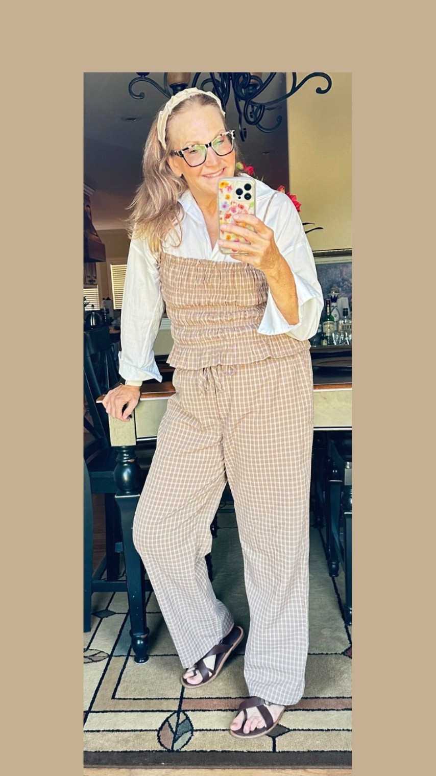 So happy how this turned out. I took this  2 piece  seersucker set and added a button down under it.  The smocked tank features adjustable spaghetti straps, a straight neckline, and a charming ruffled hem, and the pull-on, elastic waist drawstring pants offer a relaxed, wide-leg . Lots of length in the pants and plenty of stretch in the top. It runs a tiny bit large  but mostly I’d rank it as true to size This set comes in brown and black only and has plenty of stock and lots of sizing options❤️

#LTKFindsUnder50 #LTKStyleTip #LTKSaleAlert