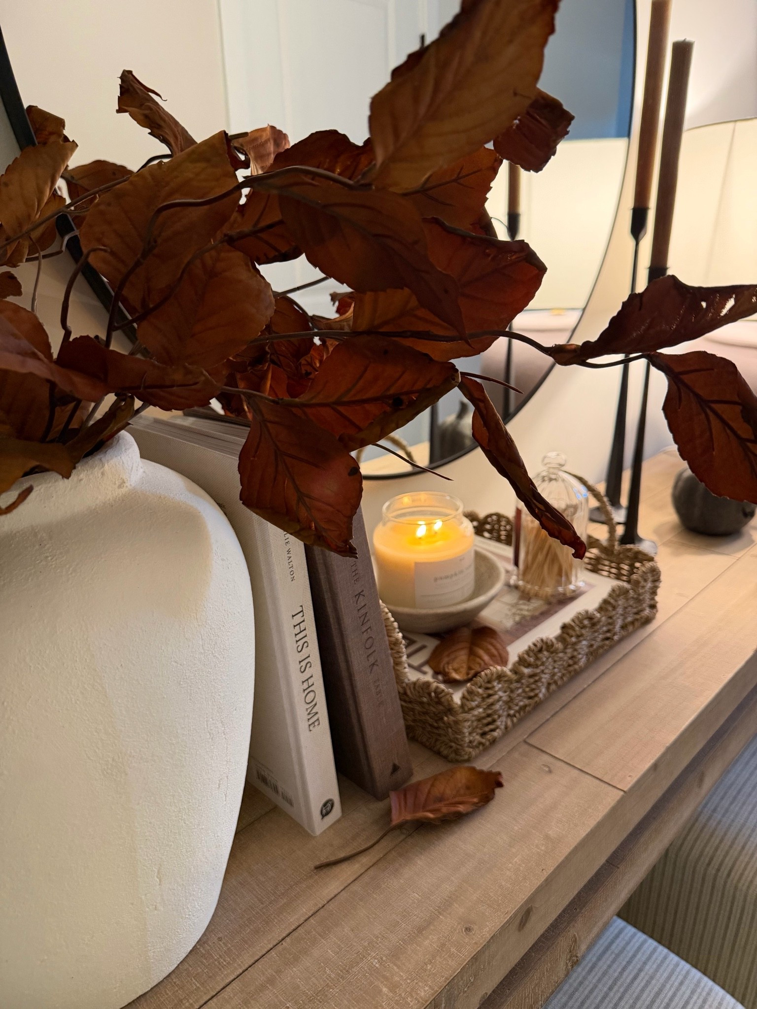 Fall decor, fall console styling, fall magnolia leaves, scallop tray, cream vase, wood console, round mirror, ottoman

#LTKSaleAlert #LTKHome #LTKSeasonal