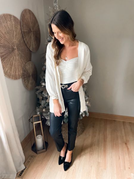 These coated pants from @express are so fun! I love how they instantly jazz up your outfit, plus they are insanely comfortable. Something about this black and ivory combo is so classic. 👌🏻 #expresspartner #expressyou

Bodysuit - small
Cardigan - medium 
Pants - 2 long 