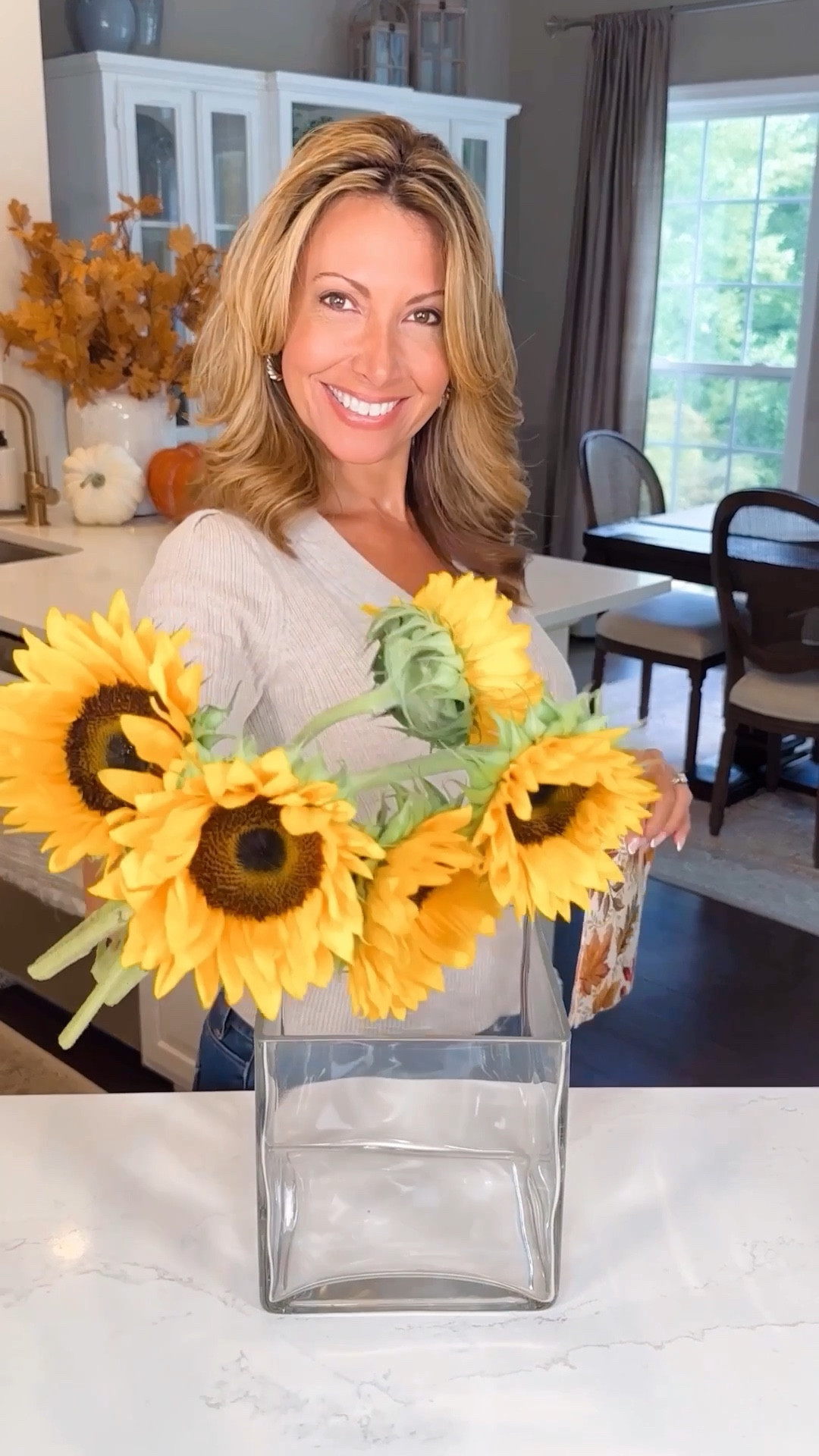 Golden Autumn Floral Arrangement 💛 Look like a professional floral designer with this autumn themed floral vase bouquet.

I layered the two vases inside each other, lined my larger vase with a festive fall printed paper dinner napkin, adding a warm and vibrant touch to complement both the flowers and my golden autumn theme. 

I filled my interior vase with water and using the popular tape grid method, I arranged fresh sunflowers, mums, dahlias and eucalyptus- into a sophisticated arrangement. No more slouchy flower. You can use faux florals as well 🌻

This arrangement would make for a perfect hostess gift, fall gathering centerpiece or autumn birthday present.

#LTKSeasonal #LTKFind #LTKhome