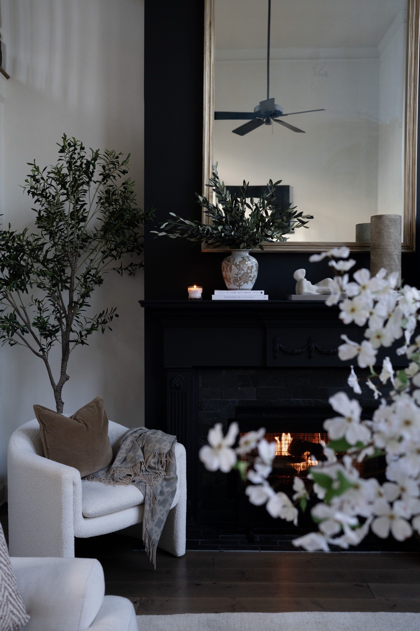 OMG these olive stems in this statement vase might be my favorite styling moment in the whole room. The soft greenery paired with the neutral ceramic pattern creates such a beautiful focal point on the fireplace mantel. It adds height, texture, and that effortless modern organic interior design look.

#LTKSeasonal #LTKSpringSale #LTKHome