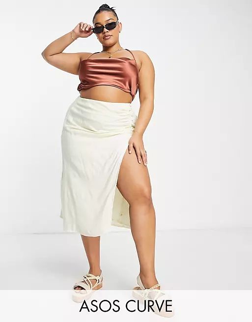 ASOS DESIGN Curve drapey button side thigh split midi skirt in cream | ASOS (Global)