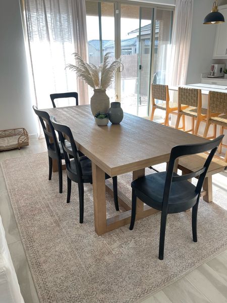 Natural wood Dining table with black chairs and bench. Open floor plan design. 

#LTKfindsunder50 #LTKstyletip #LTKhome