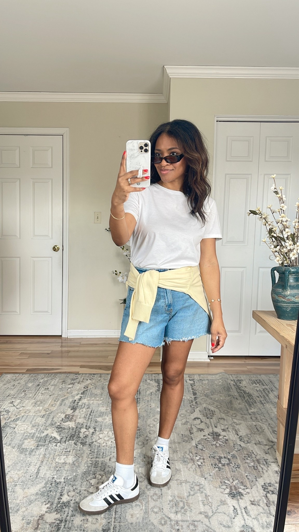 I’m wearing a small in the Zara shirt (linking similar) and a small in the yellow sweater. The yellow top is more of a lightweight sweatshirt material and the material is very soft. I really recommend it. My shorts are a size 27 and the curve love range. I recommend sizing 1/2 down in the Adidas sneakers. ￼

