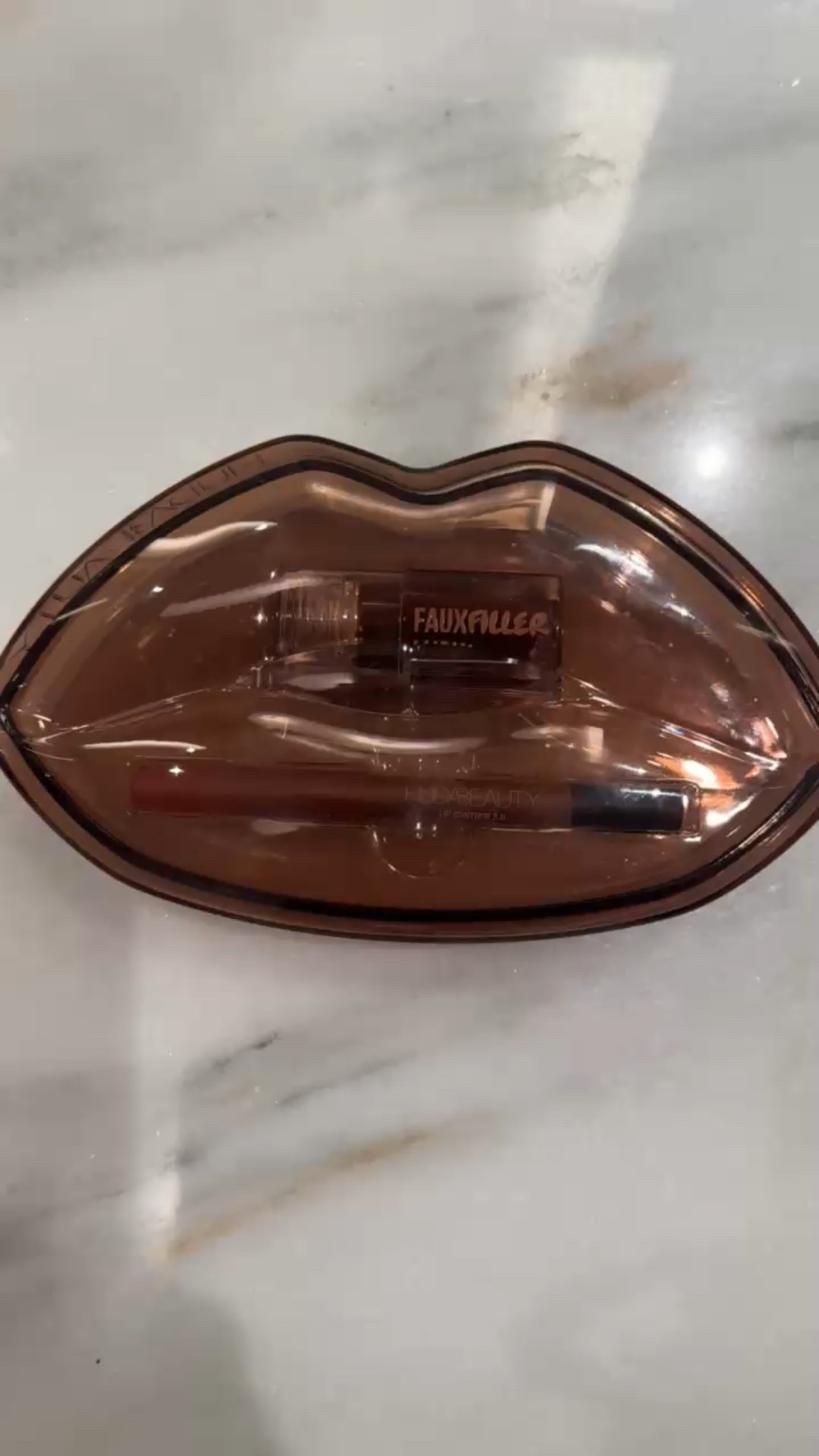 Was not expecting this Huda Beauty duo to come in such cute packaging! Love how they styled the best color combination to take some of the guess work out. My exact shades here are the Warm Brown lip stain and the Juicy Pink Lady gloss. Remember to blot the stain out a little bit when you apply. It doesn’t budge!

#LTKFindsUnder50 #LTKBeauty #LTKStyleTip