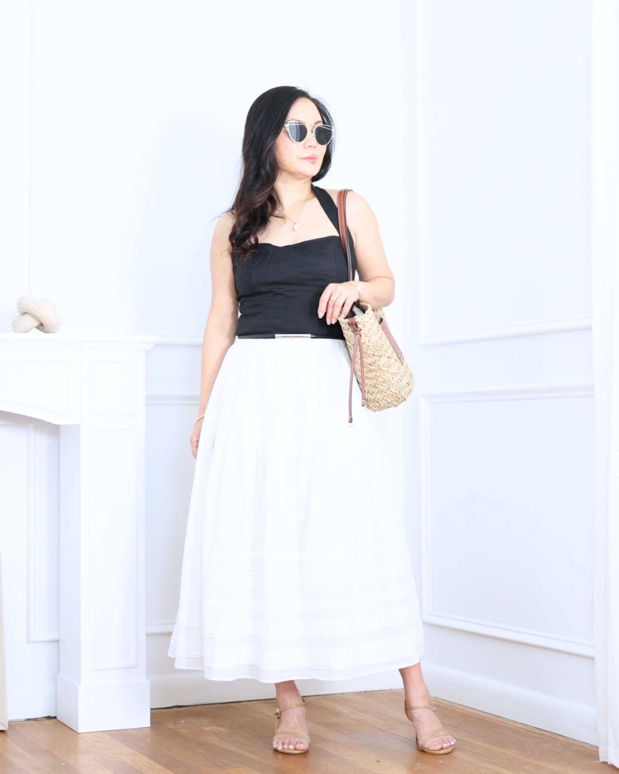 Black halter top from Quince paired with a white boho maxi skirt from Abercrombie — the perfect contrast of sleek and flowy. Effortless, feminine, and made for warm days when you want to feel both comfortable and chic. I'm 5'2, wearing size S. 

 #LTKootd #LTKOver40 #LTKPetite