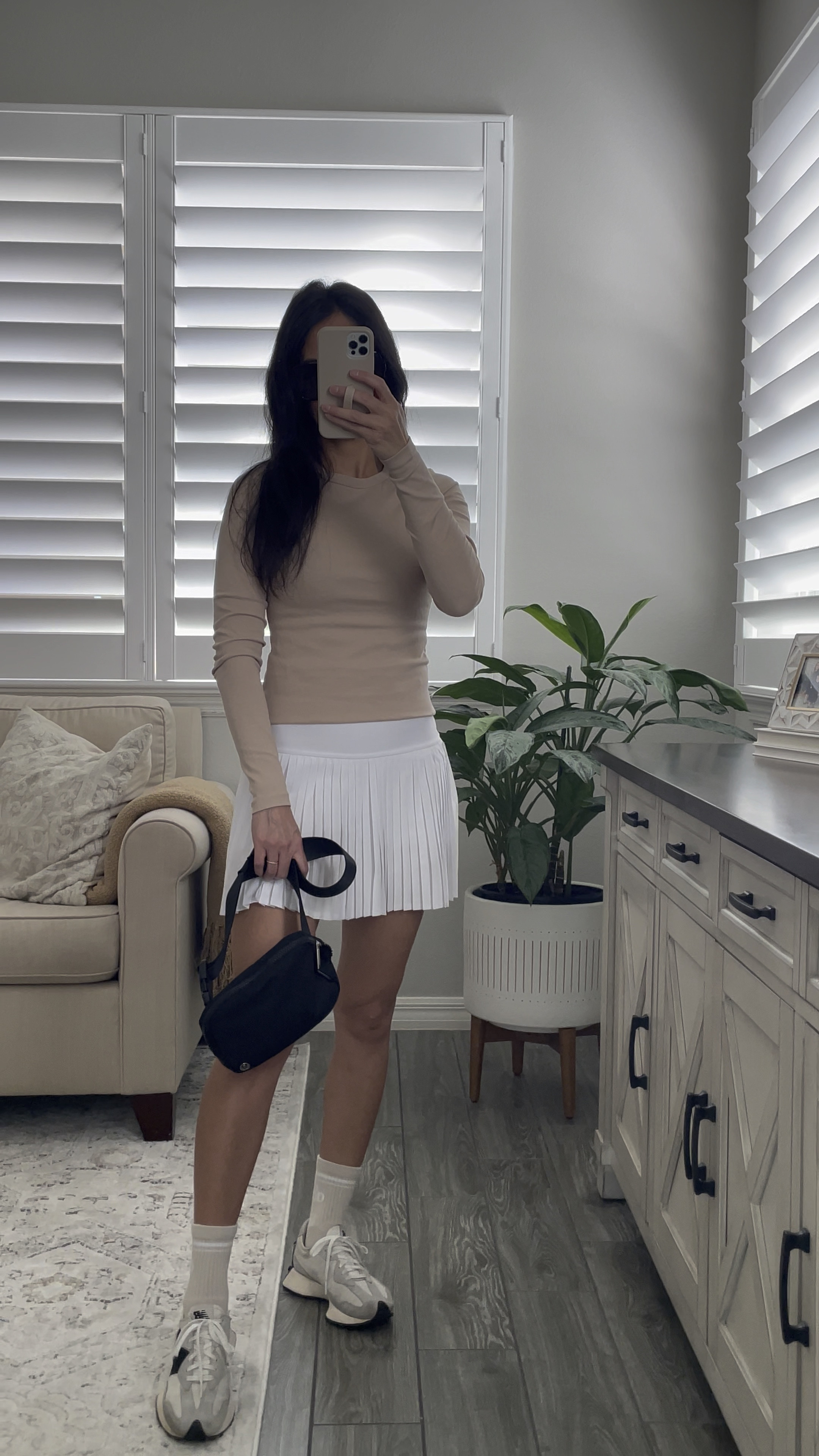 What I’m wearing as a mom of 3 for school drop offs and pick ups and all the errands in between! 
I can’t get enough of this white tennis skirt. The pleats and built in shorts makes it fun but also perfectly wearable to run around with kids. Such soft material. I’m loving with beige and white color combo. I’m wearing an XS in skirt and size small for shirt. New balance 327 sneakers are back in stock! 🙌

Mom outfit 
Neutral style
What to wear 
Fall style 
Fall fashion
Alo skirt 
New balance sneakers 
Mom style 

#LTKStyleTip #LTKSaleAlert #LTKWatchNow