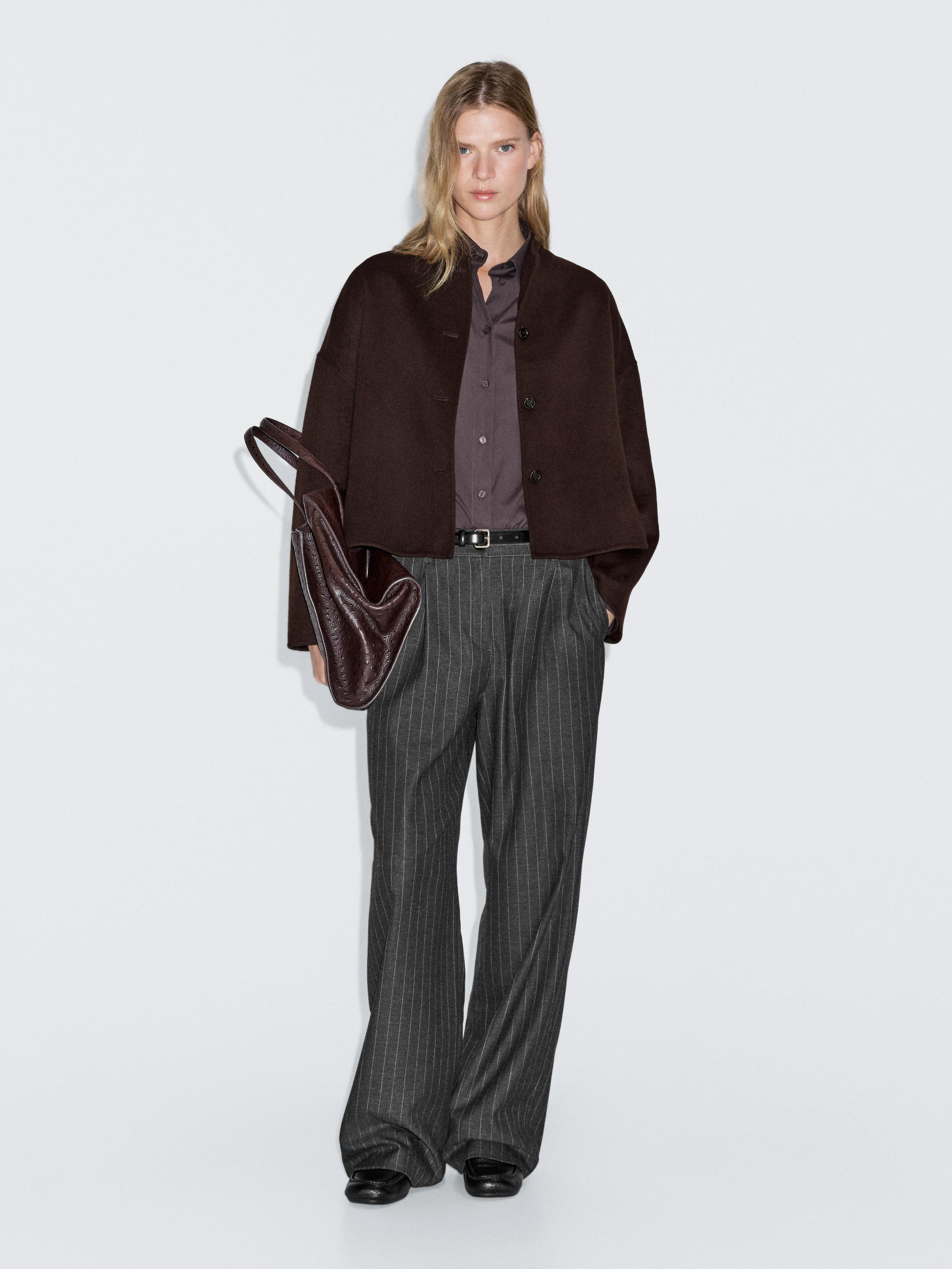 Cropped jacket made of a wool blend. Long sleeves. Button-up front. High collar. Two side pockets... | Massimo Dutti US