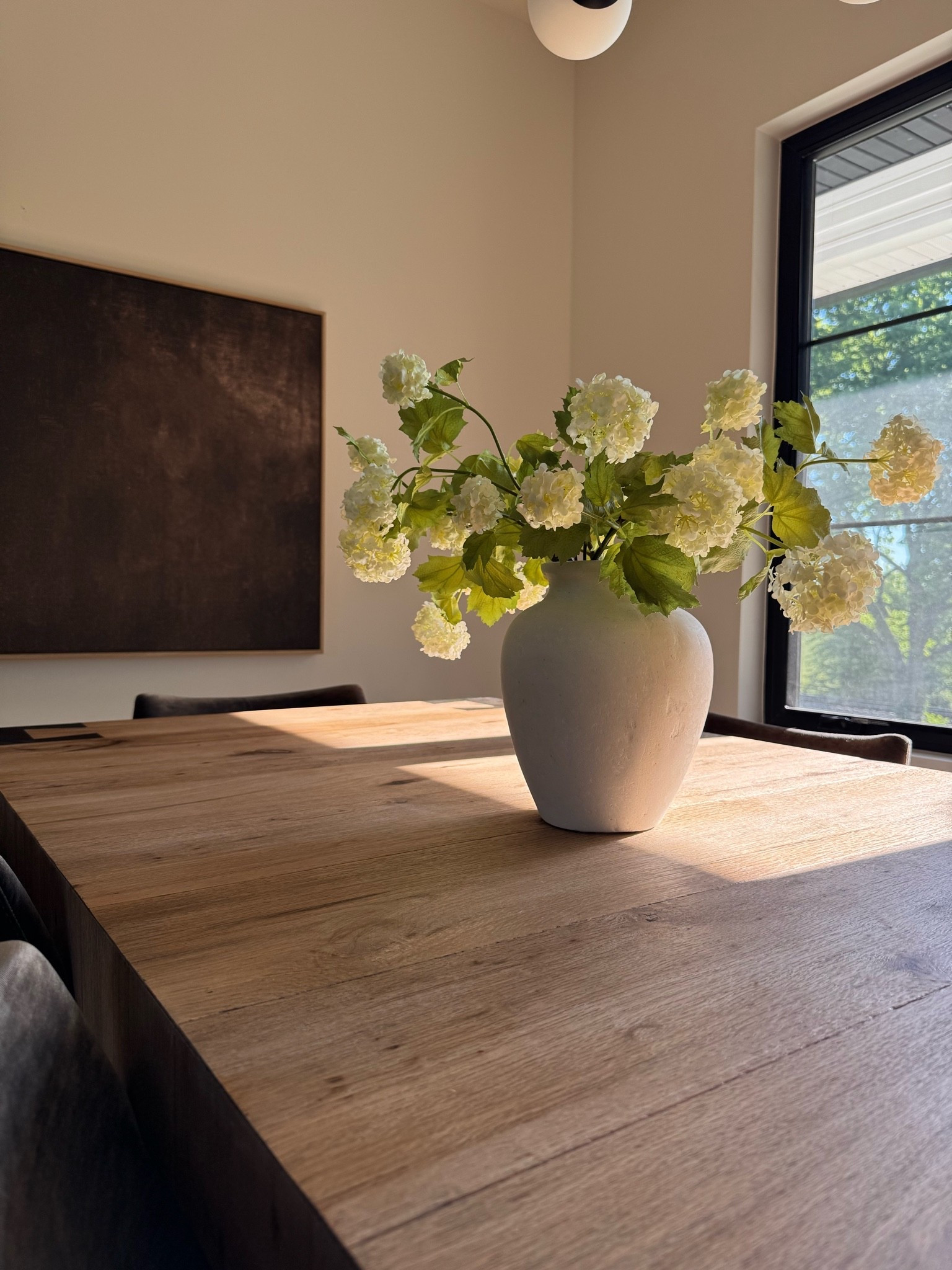 Spring dining room views. My absolute favorite vases that I own in black and ivory are on sale and so affordable. I use these year round with different seasonal stems. They are the perfect size and matte texture 🤍

My dining table is 25% off right now too! 🤎

#LTKHome #LTKSaleAlert