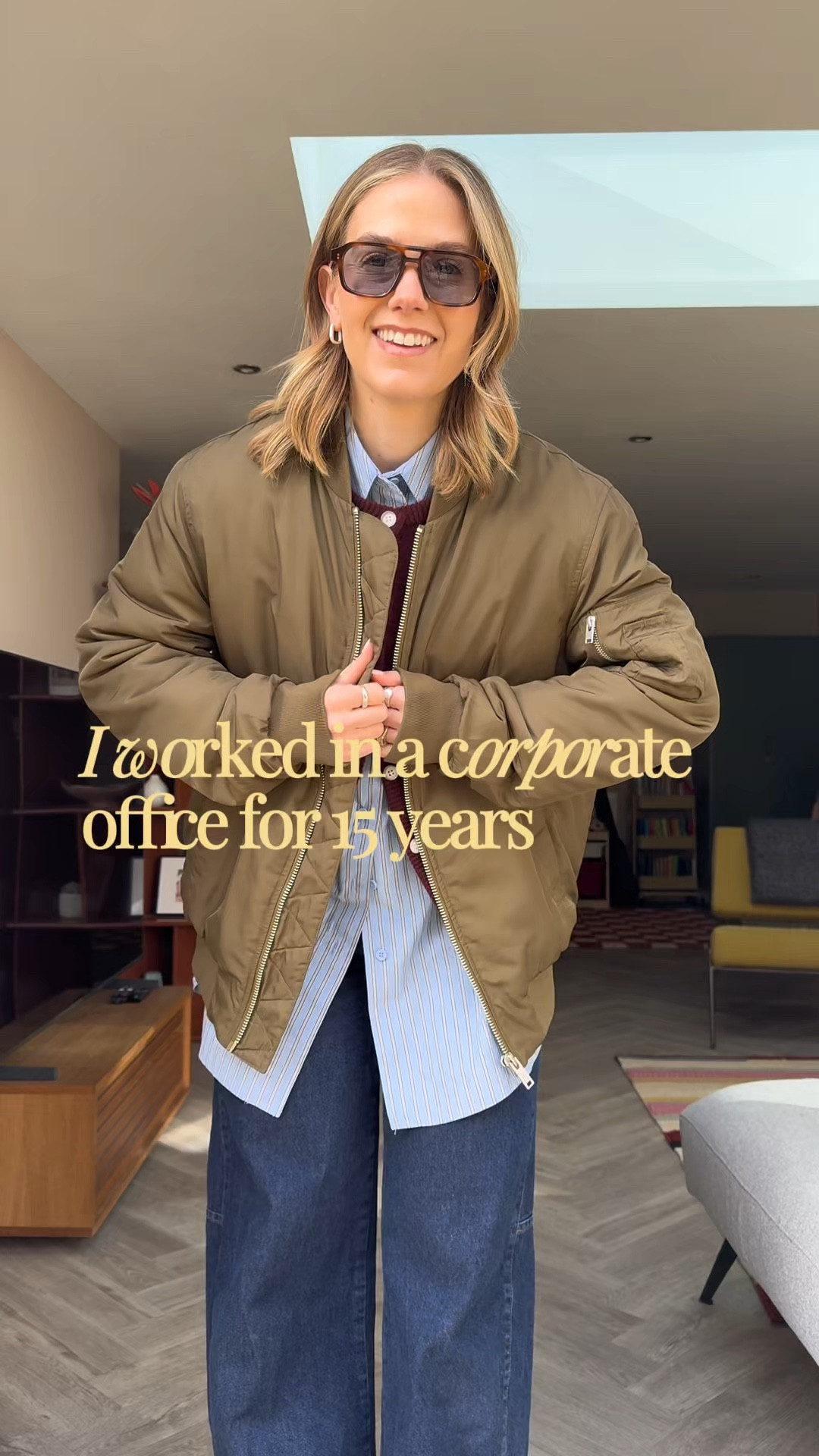 Smart casual office outfit, dark wash jeans, oversized blue shirt, burgundy cardigan 
