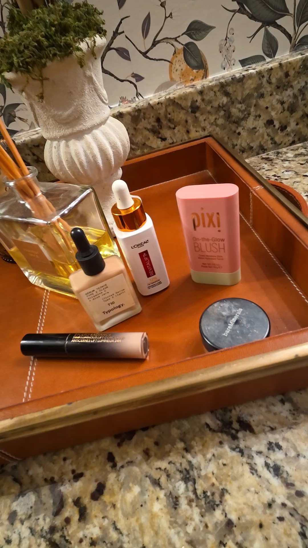 Really quick makeup routine Tried and true Staples that are true workhorses easy to travel with and have skin care benefitsBtw the tray is William Sonoma home from many years ago and I love using leather and brass on my vanity to warm up the space as I'm having a love-hate relationship with the granite at the moment. 

#LTKgrwm #LTKmorningroutine #LTKOver40