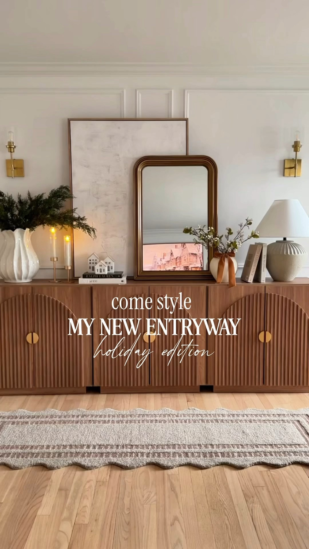 My new entryway is finally complete, and I’m in love with how everything turned out! ✨🤍🌲 I’ve been craving a clean, classic holiday vibe this season, and this piece fluted sideboard is both gorgeous and so functional ( I added 3 pieces to get this look) 
I love that it hides shoes, stores bags, and keeps all the little things tucked away so the space stays fresh and styled. 

#LTKHome #LTKHoliday #LTKSaleAlert