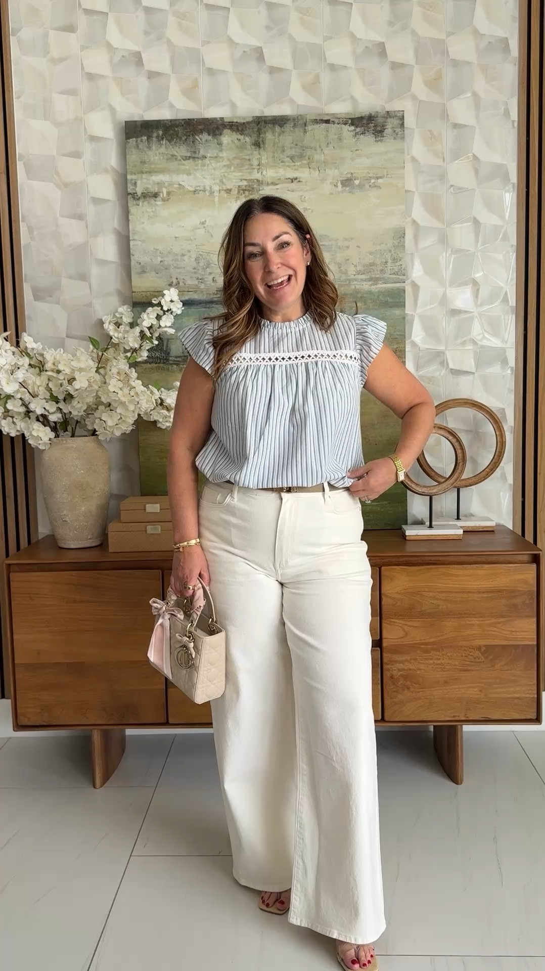 🩵 This blue stripe ruffle top is giving all the summer vibes — and paired with white wide-legs? Chef's kiss. 
📏Wearing top in L and Pants size up

#LTKOver40 #LTKMidsize #LTKWorkwear