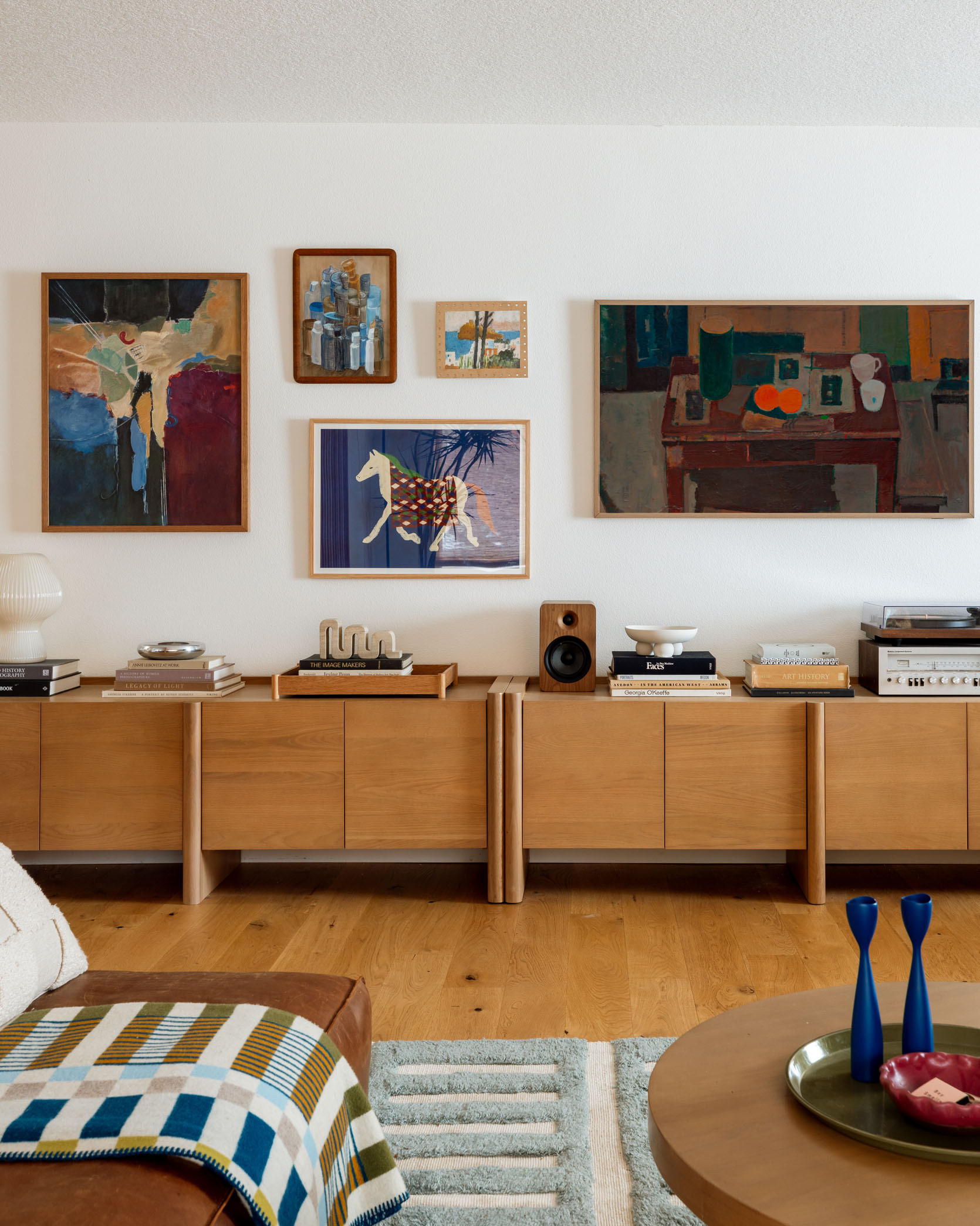The blank wall is totally transformed – two matching media units (The Torme, from Article) created a low long built-in look that not only created a lot of record and game storage but was a great surface and grounding element for a gallery wall above. Each unit features adjustable shelves inside and soft close fronts but the real kicker are the thoughtful design details – those rounded legs and beveled doors are chef’s kiss. And yes, that is a Frame TV (non-spon, just can’t stop using them) along with a few other pieces that Kaitlin sourced from The Yo Store, Schoolhouse, World Market, plus a few vintage paintings (and Gretchen even made her that little painting up top). It’s SO GOOD.

#LTKHome #LTKCyberWeek #LTKStyleTip