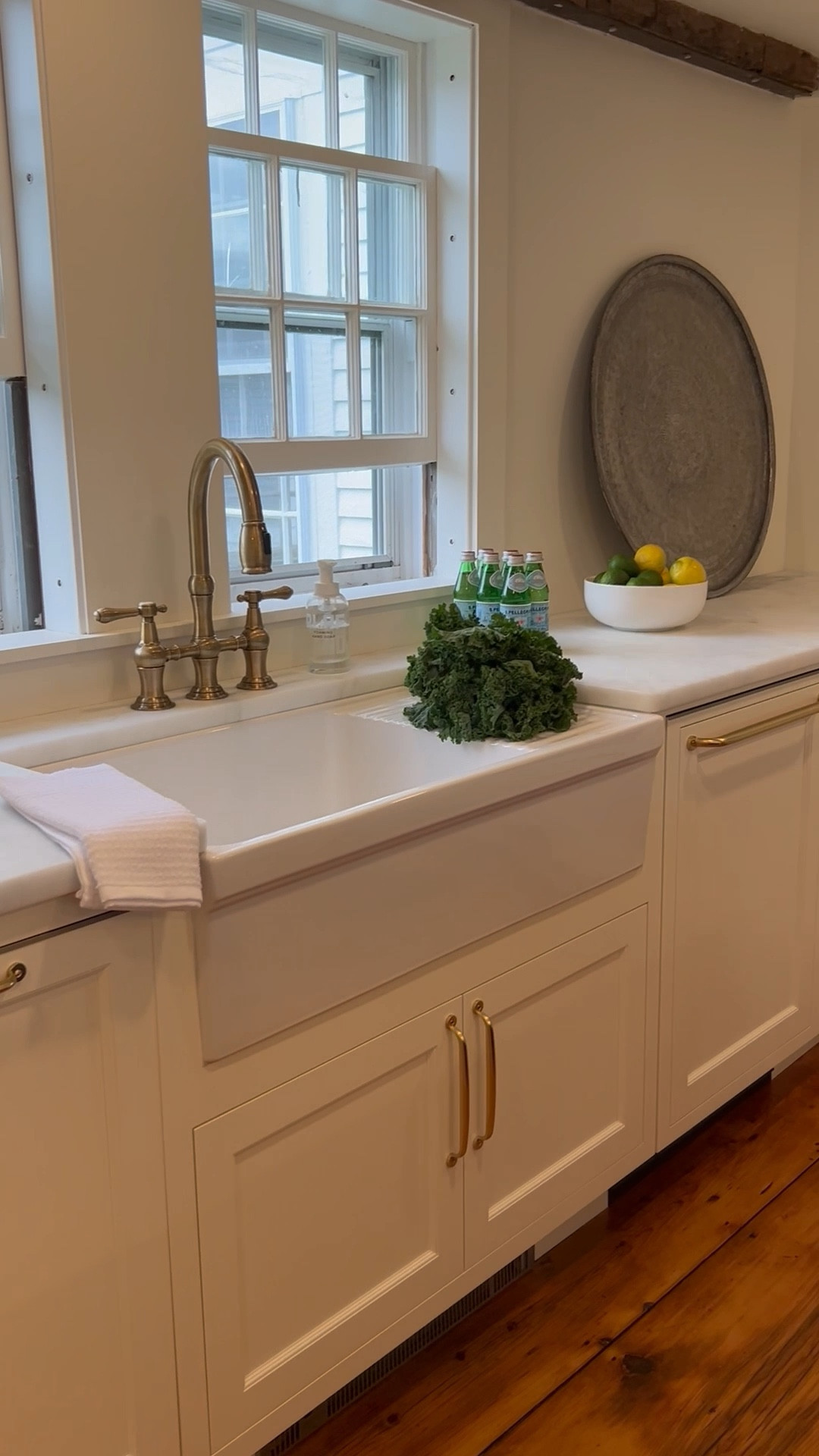 A peek into one of our recent kitchen remodels—classic details with modern functionality.
We always include a drawer microwave in our kitchen projects, and this one from Café by GE is a favorite. It keeps the counters clear and is surprisingly easy for little hands to use.

The apron front sink and cabinet pulls are both from Rejuvenation, and I’m linking the exact polished brass faucet we used from Perigold. Timeless pieces that elevate the everyday.

Everything is linked here!

#kitchenremodel #kitcheninspo #drawer microwave