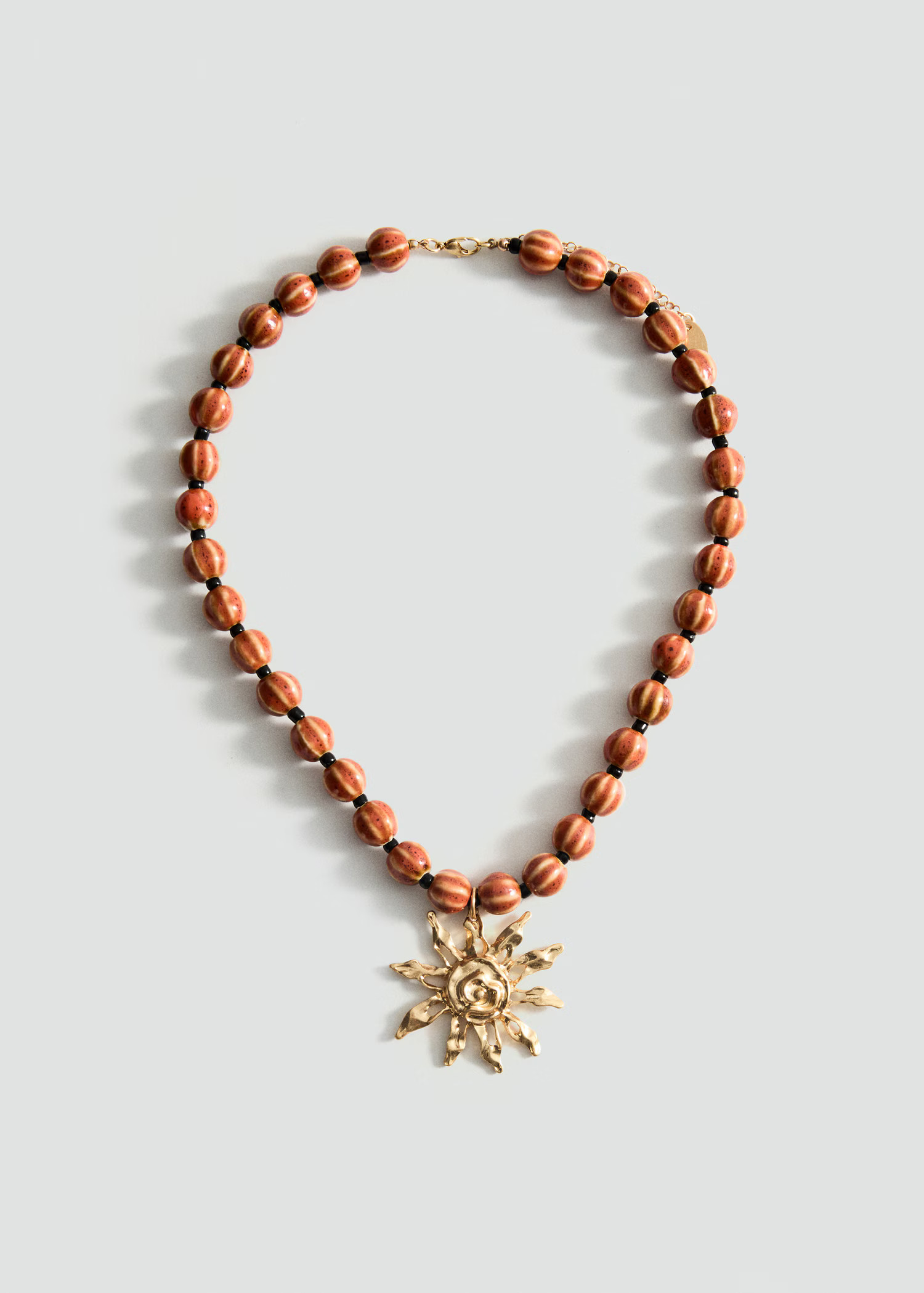 Ceramic ball necklace with sun pendant - Women | MANGO United Kingdom | MANGO (UK)