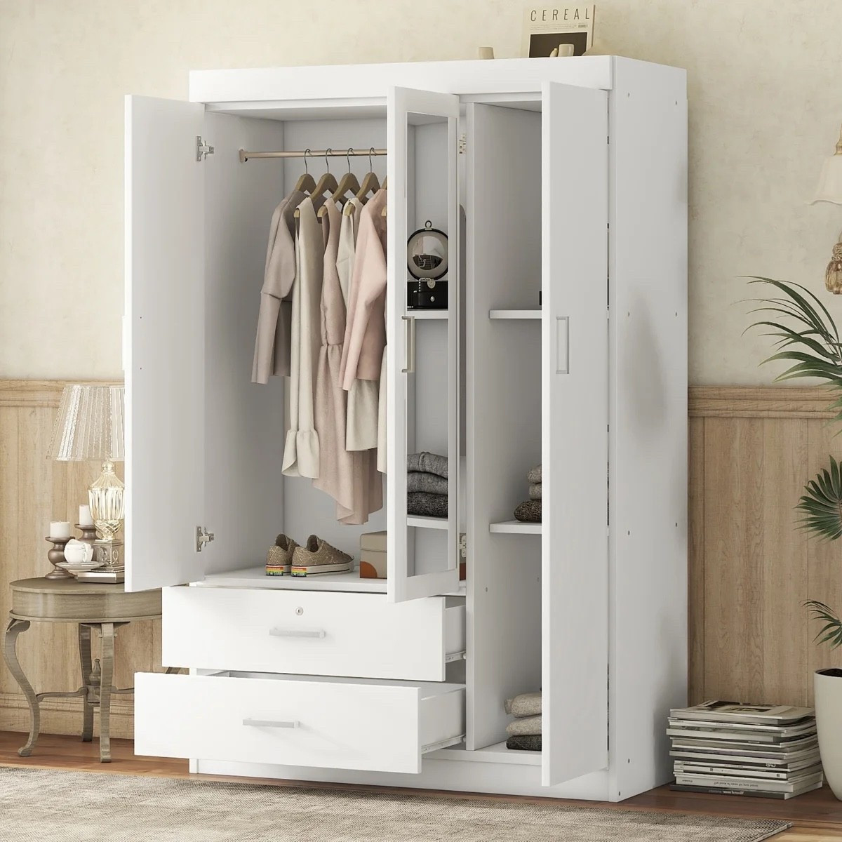 This white 3-door wardrobe from Wayfair feels like a really practical way to add closet space without making the bedroom look too heavy. The mirrored door is handy for getting dressed, and inside there’s a hanging section, open shelves, and two lockable drawers for folded clothes, accessories, or anything you’d rather keep tucked away. I like it styled with the little round side table, pleated lamp, stacked magazines, and tall floor plant. It’s currently shown at $345.99, 28% off, and included in Wayfair’s 30-Day Low Price.